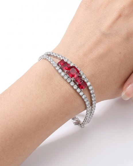 Decorated with sparkling crystal stones in a polished silver-tone setting Features bold red gemstone accents at the center for a striking look Elegant double-row bracelet design for added luxury appeal Adjustable chain with secure clasp closure for comfortable fitting Lightweight and comfortable for extended wear Perfect for parties, weddings, dinners, and special occasions A stylish gift option for birthdays, anniversaries, or celebrations