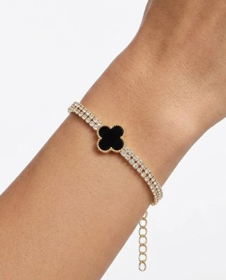 Elegant Clover Design: Iconic black clover charm for a stylish and meaningful look Premium Finish: High-quality gold-tone plating for a rich appearance Sparkling Crystals: Embedded crystals that add brilliance and shine Lightweight & Comfortable: Designed for all-day wear without discomfort Secure Clasp: Strong and easy-to-use lock for a perfect fit Versatile Accessory: Ideal for casual wear, parties, or special occasions Why You Should Purchase This Bracelet: Timeless Style – A classic design that never goes out of fashion Perfect Gift Option – Great for birthdays, anniversaries, or loved ones Adds Instant Elegance – Enhances both simple and dressy outfits Luxury at an Affordable Price – Premium look without overspending Symbolic Meaning – Clover represents luck and positivity