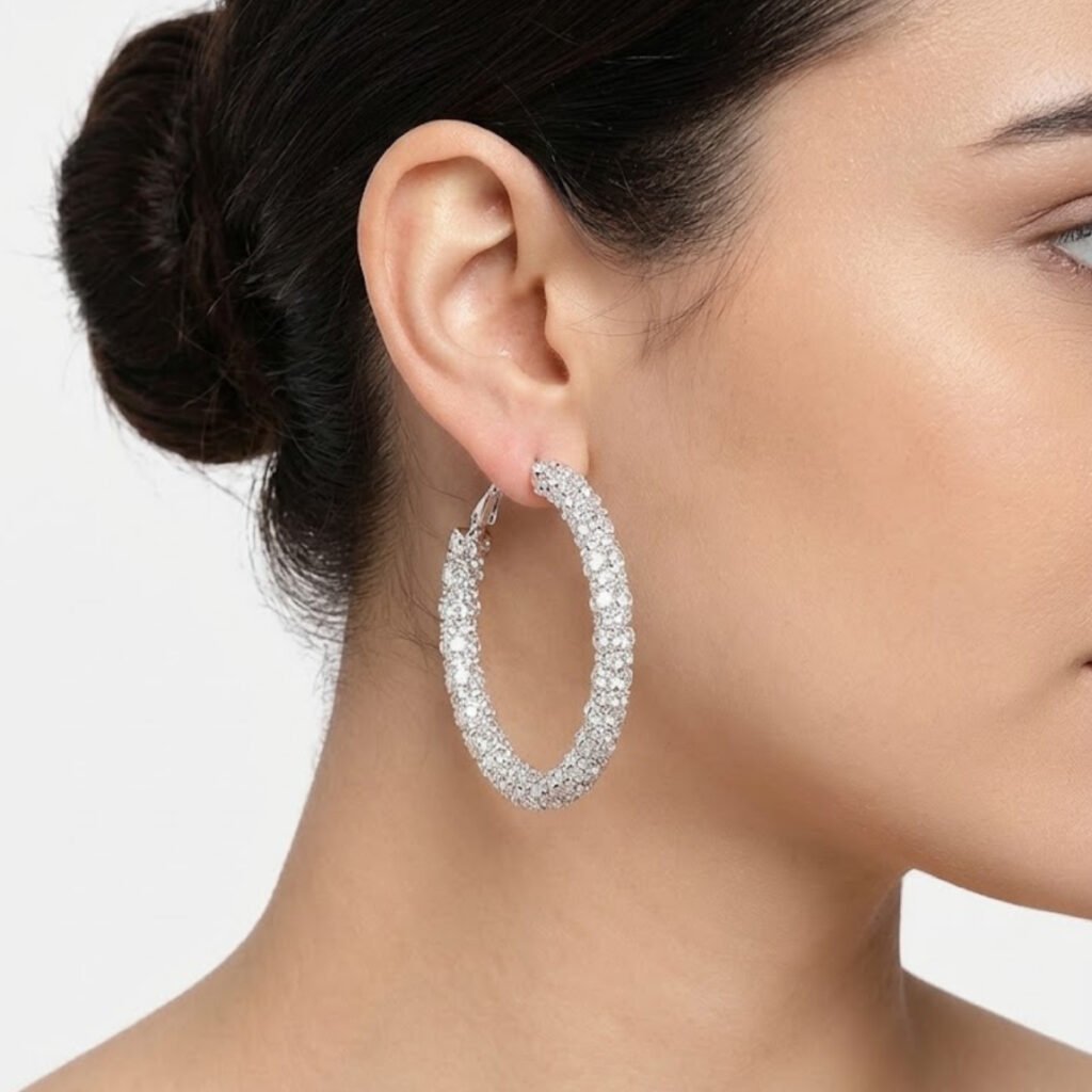 This Crystal Pave Hoop Earring features a classic hoop fully covered in sparkling crystals, offering timeless glamour for any occasion. Features: Silver tone finish Inside-out crystal design Lightweight hoop Versatile daily/formal wear Why You Should Buy: A timeless hoop design that adds sparkle without being too heavy — perfect for both daily and formal wear. Perfect For: Daily wear Formal events Gifting
