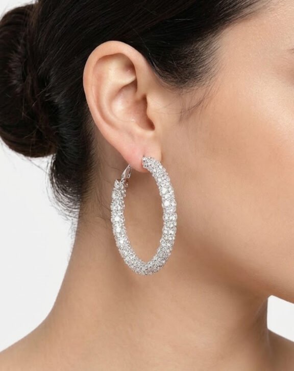 This Crystal Pave Hoop Earring features a classic hoop fully covered in sparkling crystals, offering timeless glamour for any occasion. Features: Silver tone finish Inside-out crystal design Lightweight hoop Versatile daily/formal wear Why You Should Buy: A timeless hoop design that adds sparkle without being too heavy — perfect for both daily and formal wear. Perfect For: Daily wear Formal events Gifting